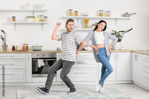 Happy young couple dancing ...