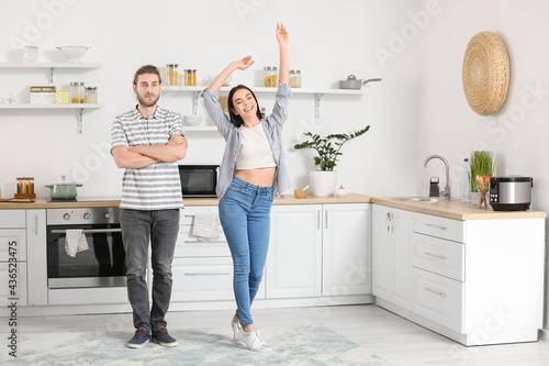 Happy young couple dancing ...