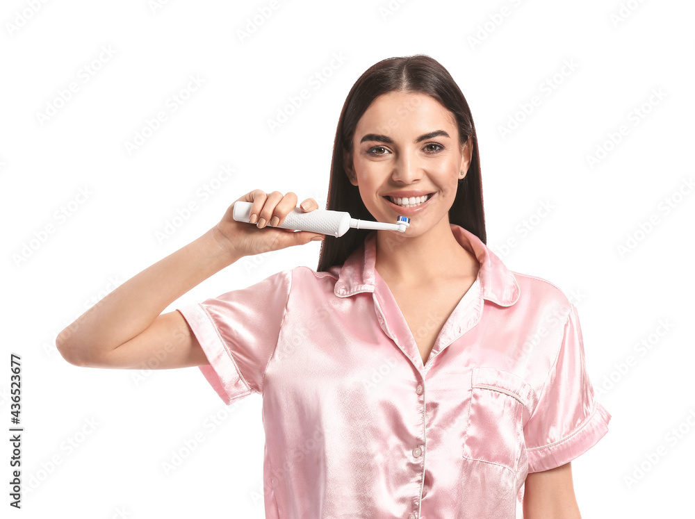 Beautiful woman brushing teeth on white background Beautiful woman brushing teeth on white background