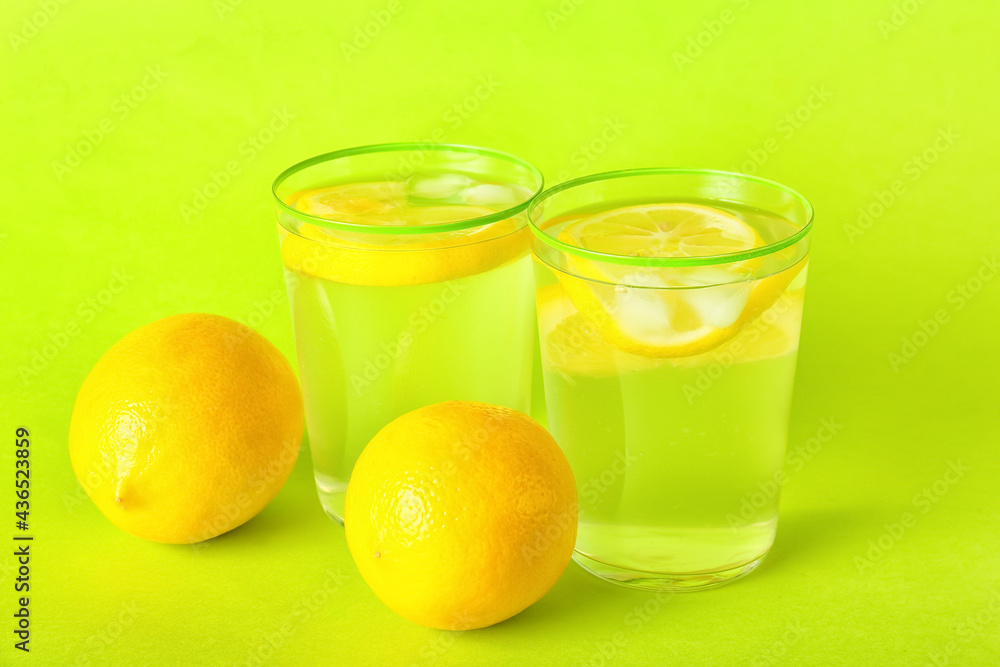 Glasses of tasty cold lemonade on color background Glasses of tasty cold lemonade on color background