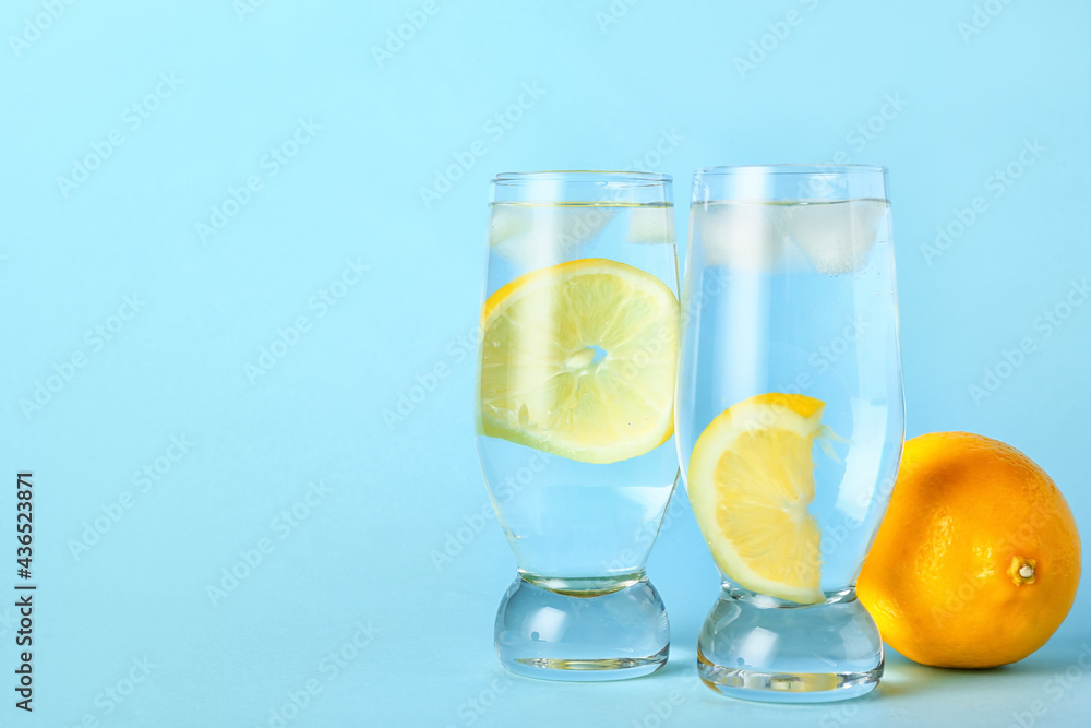 Glasses of tasty cold lemonade on color background Glasses of tasty cold lemonade on color background