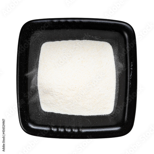 Vászonkép top view of agar powder in black bowl isolated