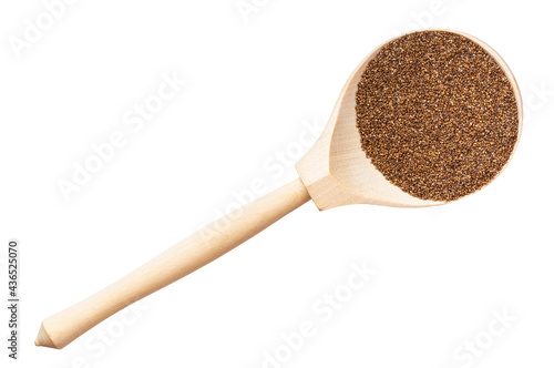 top view of whole-grain teff seeds in wood spoon