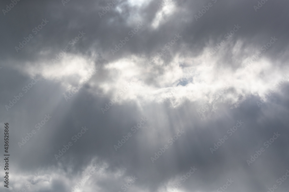 White sunlight shining through grey clouds.Shot in Sweden, Scandinavia White sunlight shining through grey clouds.Shot in Sweden, Scandinavia