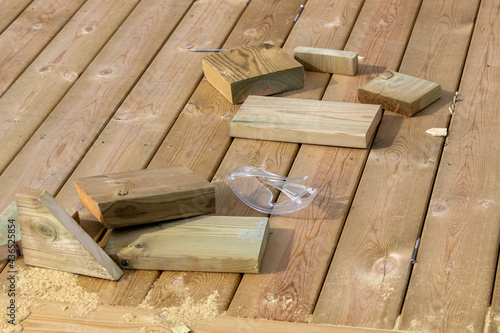 Carpenter work with pieces of wood and protective glasses. Shot in Sweden, Scandinavia