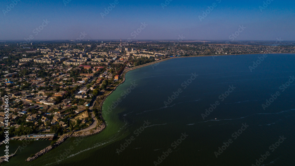Nice view of the city near the sea from a drone. Summer town Nikopol.