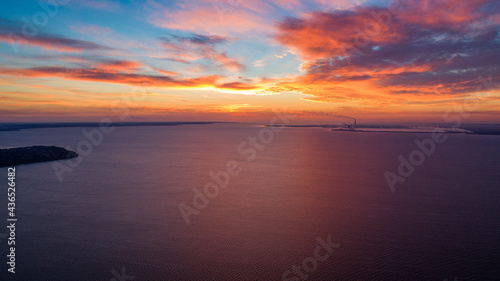 Beautiful sunrise or sunset near the sea. Photo from a drone. Pink sky. background image