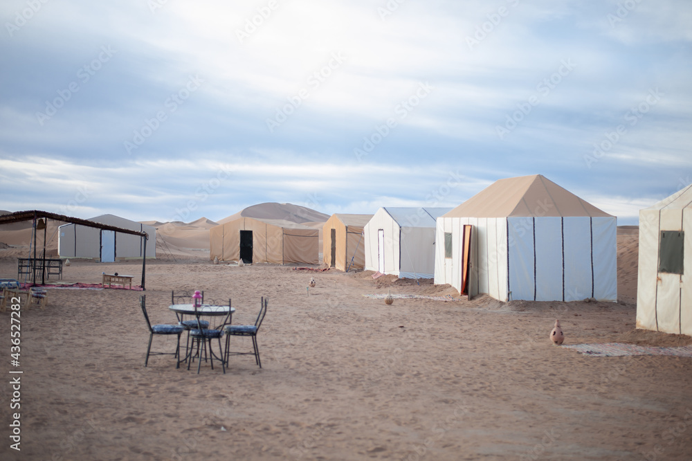 berber camp inendless expanses of the Sahara huge sand dunes at dawn of sunrise