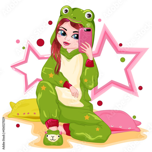 Cute teenage girl in a frog costume. A fashionable girl takes a selfie. A child in kigurumi pajamas sits on pillows. Cartoon illustration of a funny little girl