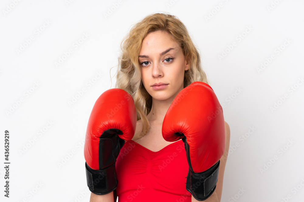 Young blonde woman isolated on white background with boxing gloves