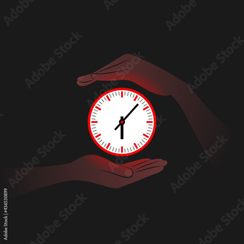 Red clock and person's hands near it in darkness
