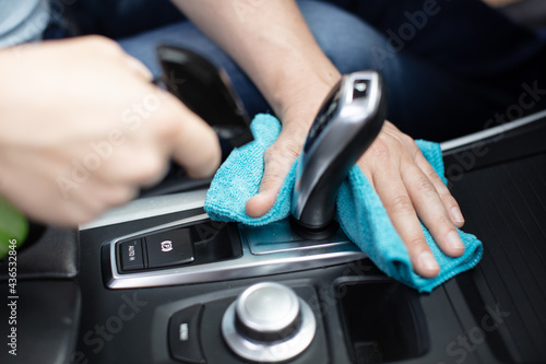 man cleaning a car interior