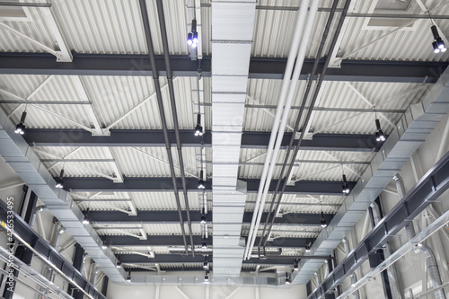 ceiling interior with ventilation pipes and technology of factory building