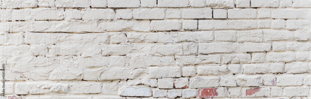 Panoramic scenery with white brick wall with peeling plaster Panoramic scenery with white brick wall with peeling plaster