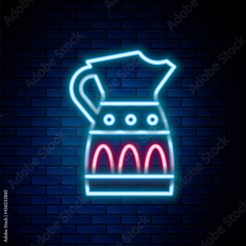 Glowing neon line Sangria pitcher icon isolated on brick wall background. Traditional spanish drink. Colorful outline concept. Vector