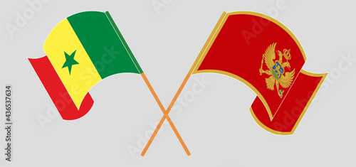 Crossed and waving flags of Senegal and Montenegro
