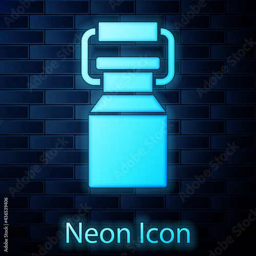 Glowing neon Can container for milk icon isolated on brick wall background. Vector