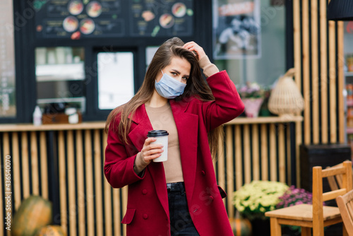 Young woman with a face mask in restaurant, New normal concept for protect coronavirus pandemic