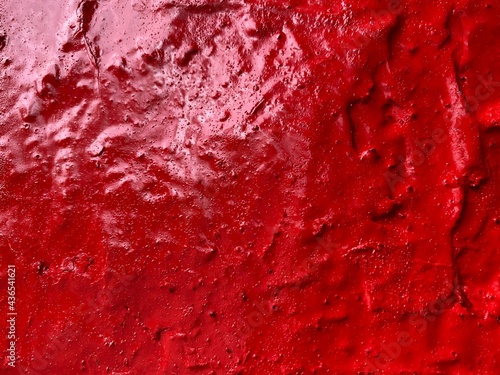 Red background. Bright red color glossy wall. Satined texture. photo