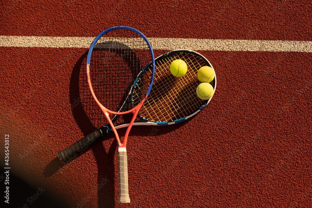 Tennis Ball with Racket on the racket in tennis court