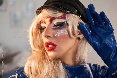 Obraz na płótnie Drag queen with creative makeup with glitters posing to the camera