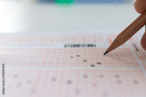 Canvas Print student studying a questioner on table