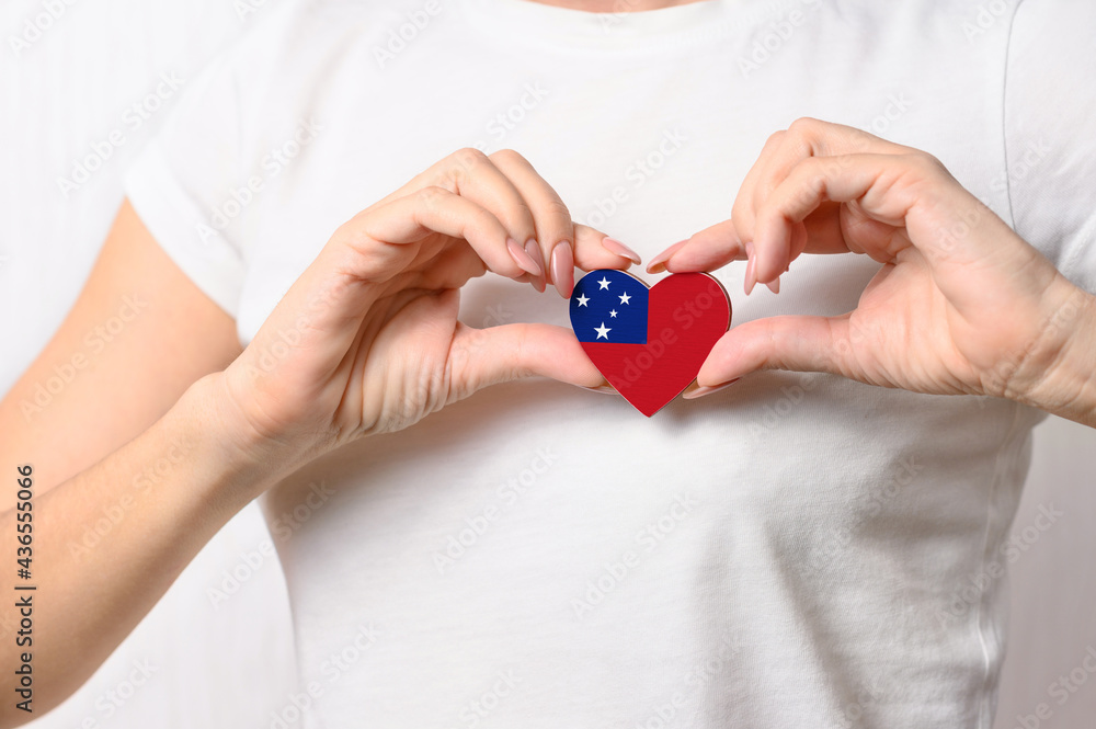 Flag of Samoa in the shape of a heart in the hands of a girl. Love Samoa. The concept of respect for Samoa Flag of Samoa in the shape of a heart in the hands of a girl. Love Samoa. The concept of respect for Samoa