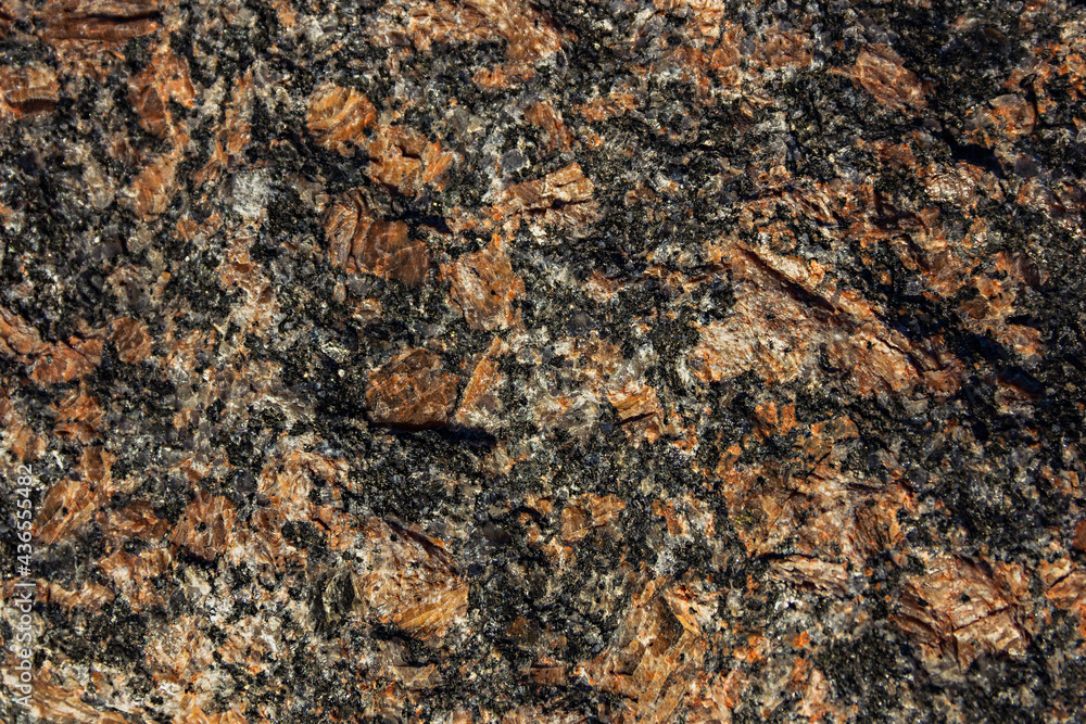 Texture of natural granite with veins of yellow. The mineral cut. Can be used as a background.