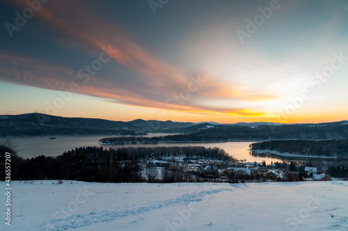 The January sunrise over Lake Solina seen from the viewpoint in Polańczyk. Polanczyk, Bieszczady Mountains. © LukaszB