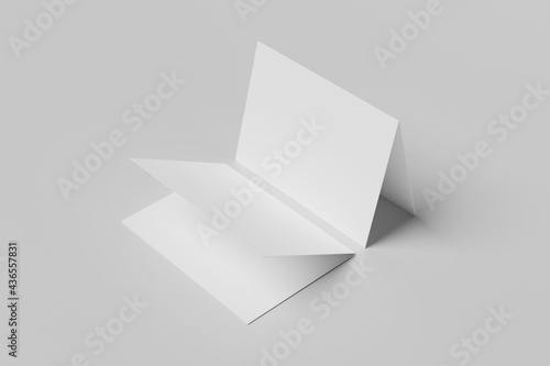 Realistic blank square two-leaf brochures paper card isolated on background. Space for text. photo