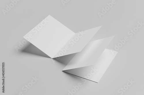 Realistic blank square two-leaf brochures paper card isolated on background. Space for text. photo