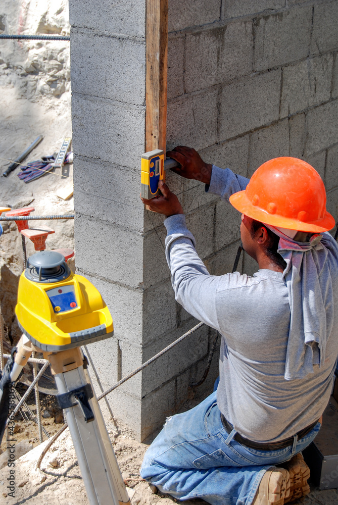 Using a laser to set a benchmark elevation Stock Photo Adobe Stock