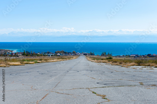 Slika na platnu Abandoned airport asphalt runway near Issyk Kul Lake in Kyrgyzstan