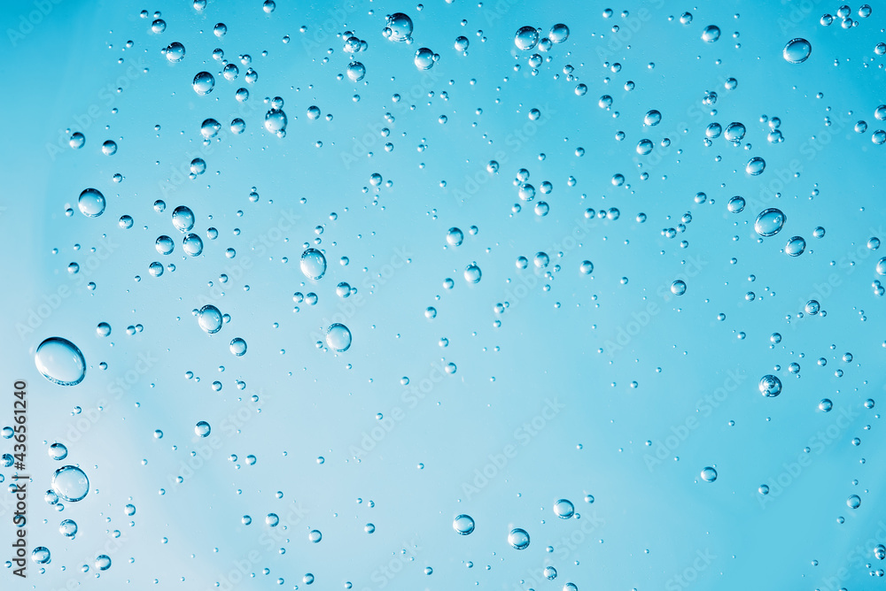 Close up macro Aloe vera gel cosmetic texture blue background with bubbles. Close up macro Aloe vera gel cosmetic texture blue background with bubbles.