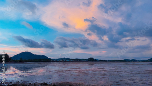 twilight time sunset at park beach with low tide, Sapanhin Phuket Thailand May 15,2021.