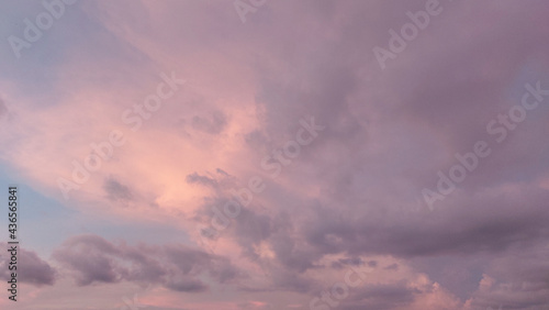 sunset with colorful cloudy sky in twilight time,fluffy cloud before rain