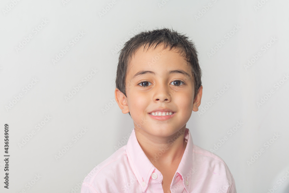 The cute boy spoke and made many expressions of emotions..Studio portrait, concept with white background. . The cute boy spoke and made many expressions of emotions..Studio portrait, concept with white background. .
