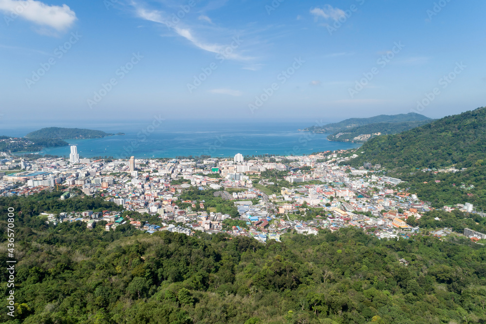 Aerial view blue ocean and blue sky with mountain in the foreground at Patong Bay of Phuket Thailand Landscape of patong city phuket in sunny summer day time Beautiful tropical sea High angle view