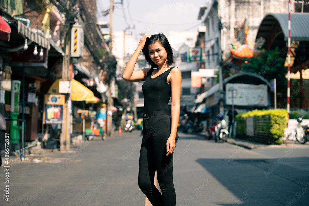 Fototapeta premium Female feels happy to walk street outdoor for shopping