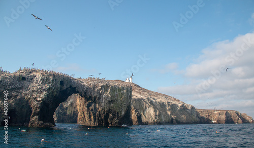 Anacapa Island arch rock formation and lighthouse in the Channel Islands National Park offshore from the Ventura area of southern California USA