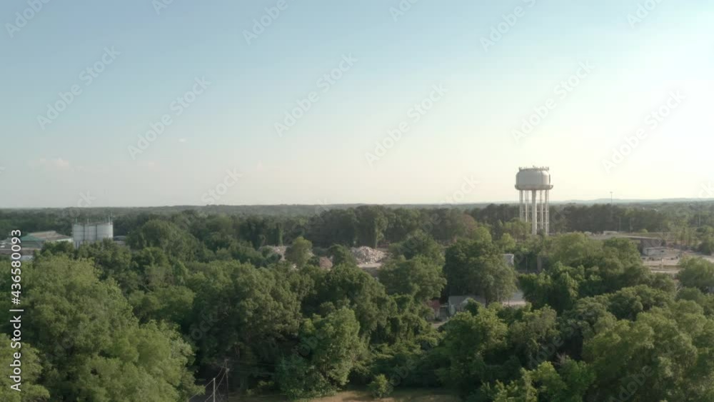 Aerial shot of water tower on horizon. Aerial shot of water tower on horizon.