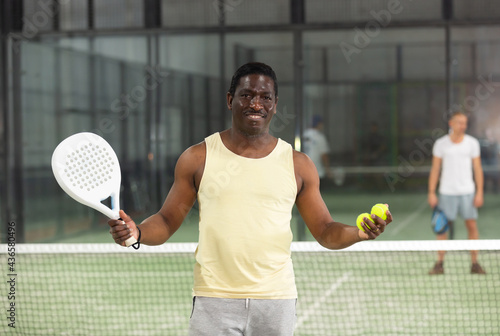 Padel tennis player posing in court © JackF