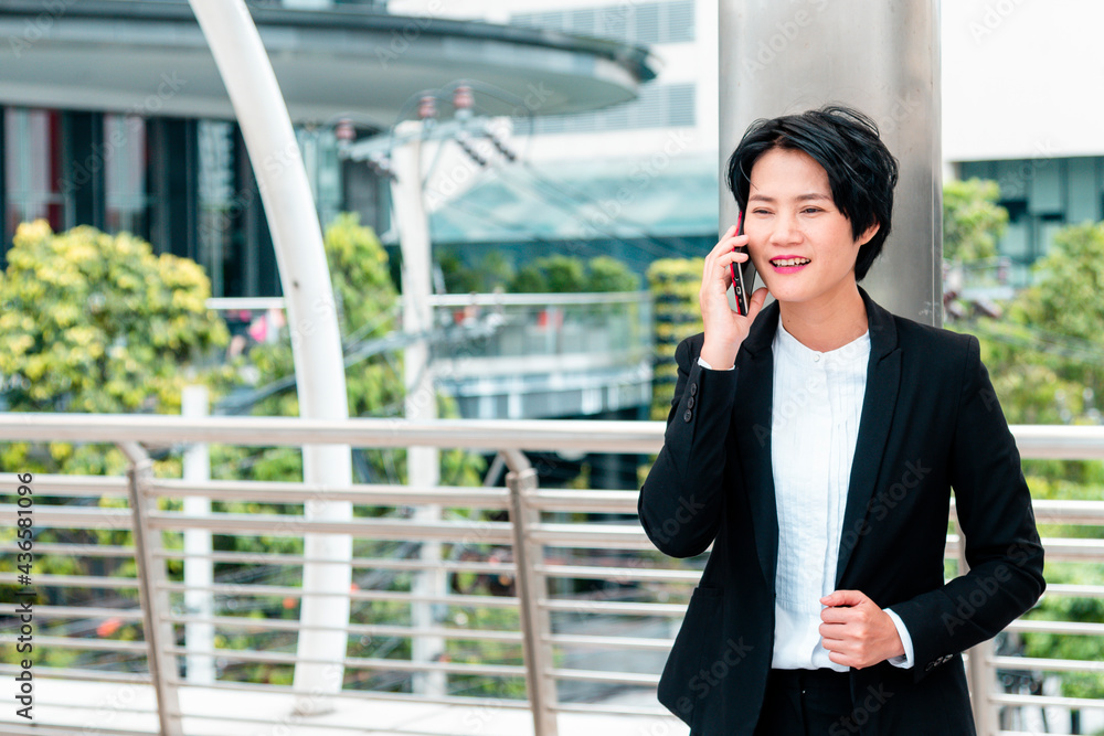 Business woman using smartphone shopping online, call, texting message internet technology lifestyle. Asian woman using cellphone walking on city street. Smart phone smart confident woman modern city Business woman using smartphone shopping online, call, texting message internet technology lifestyle. Asian woman using cellphone walking on city street. Smart phone smart confident woman modern city