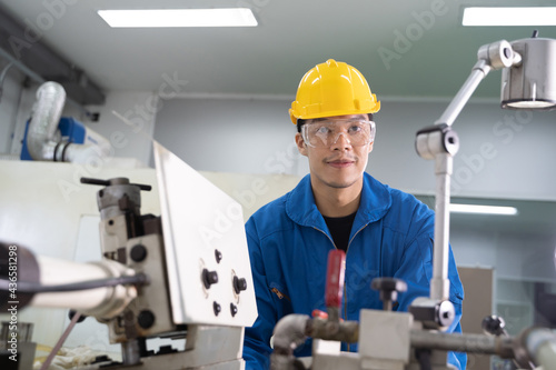 Portrait of Asian maintenance engineer workers working machines in the factory.