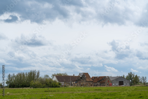 dilapidated house with dark clouds