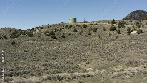 Low aerial pass over the wilderness of Eureka City Utah flying towards the Water Tower