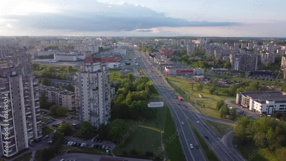 AERIAL Panning to side shot over a Highway in a Soviet Planned Residential District Seskine in Vilnius, Lithuania AERIAL Panning to side shot over a Highway in a Soviet Planned Residential District Seskine in Vilnius, Lithuania