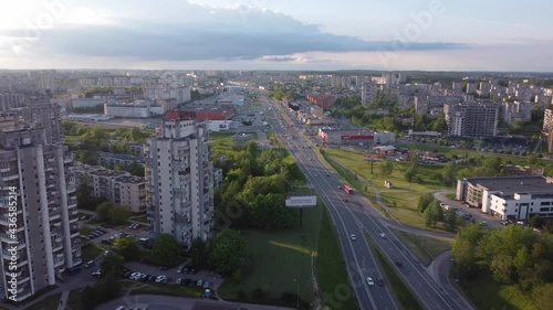 AERIAL Panning to side shot over a Highway in a Soviet Planned Residential District Seskine in Vilnius, Lithuania photo