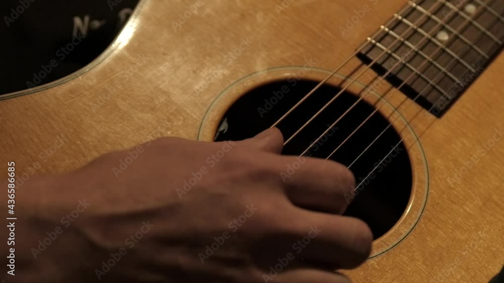 Close up of guitarist musician playing guitar on stage. Close up of guitarist musician playing guitar on stage.