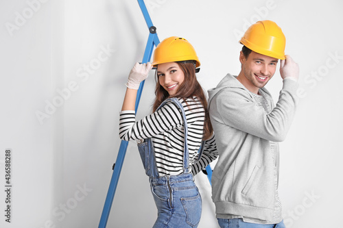 Happy young couple during repair in their new house